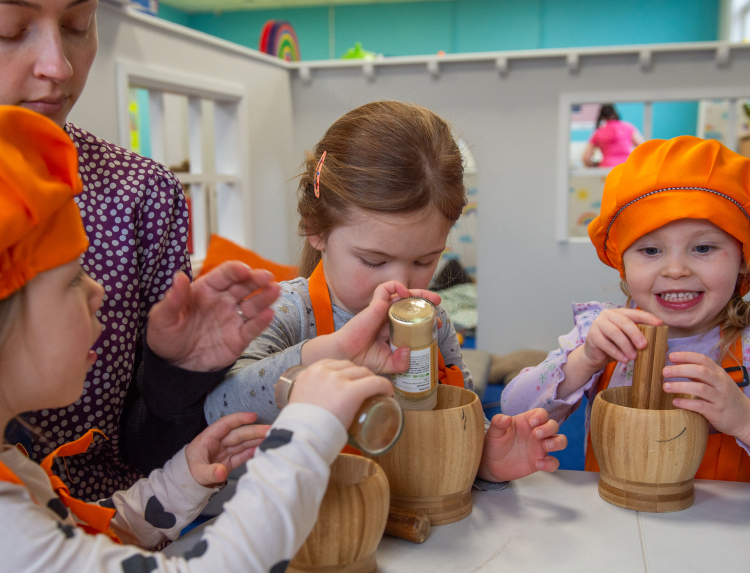 Children enjoying outdoor play at The Orange Tree nursery